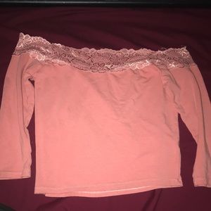 Off the shoulders with flower design at the top, size small